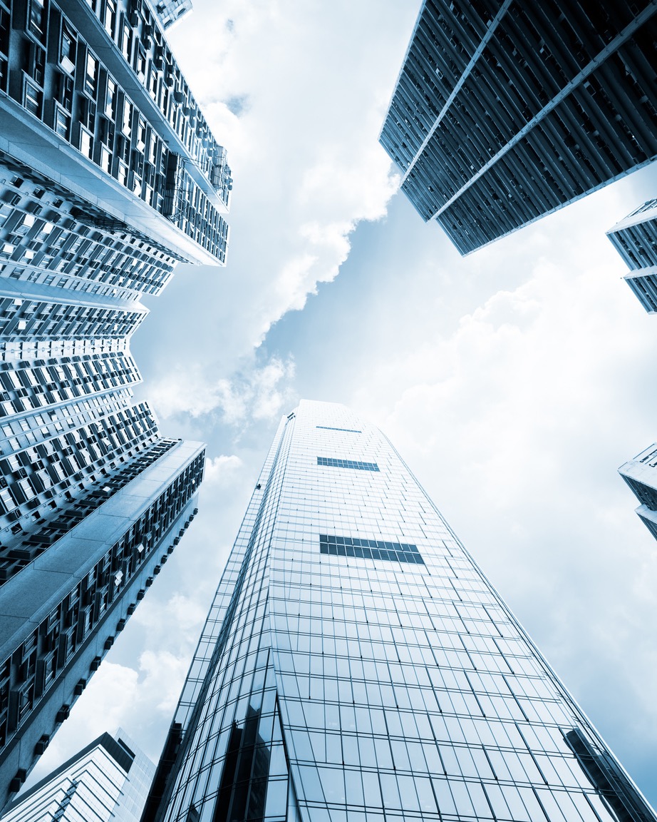 Skyward view of high-rise towers in a business district
